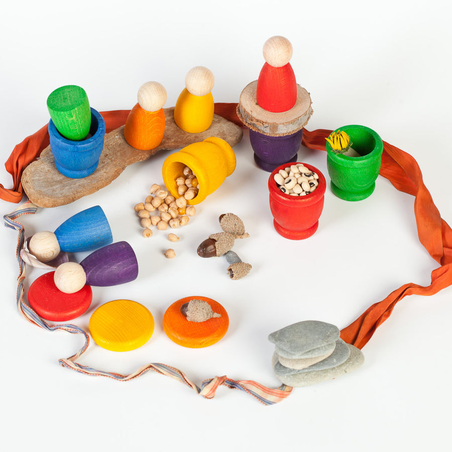 Grapat Nin Mates & Coins Wooden Toy Set. A rainbow coloured set of wooden Nin peg dolls and their corresponding Mates (cups) and coins