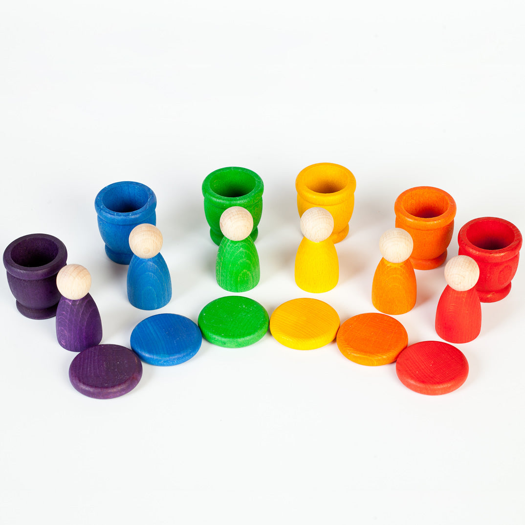 Grapat Nin Mates & Coins Wooden Toy Set. A rainbow coloured set of wooden Nin peg dolls and their corresponding Mates (cups) and coins