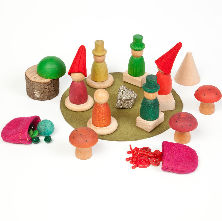 a wooden peg doll set to create a magical woodland scene. Perfect for story telling and imaginative small world play. White background.