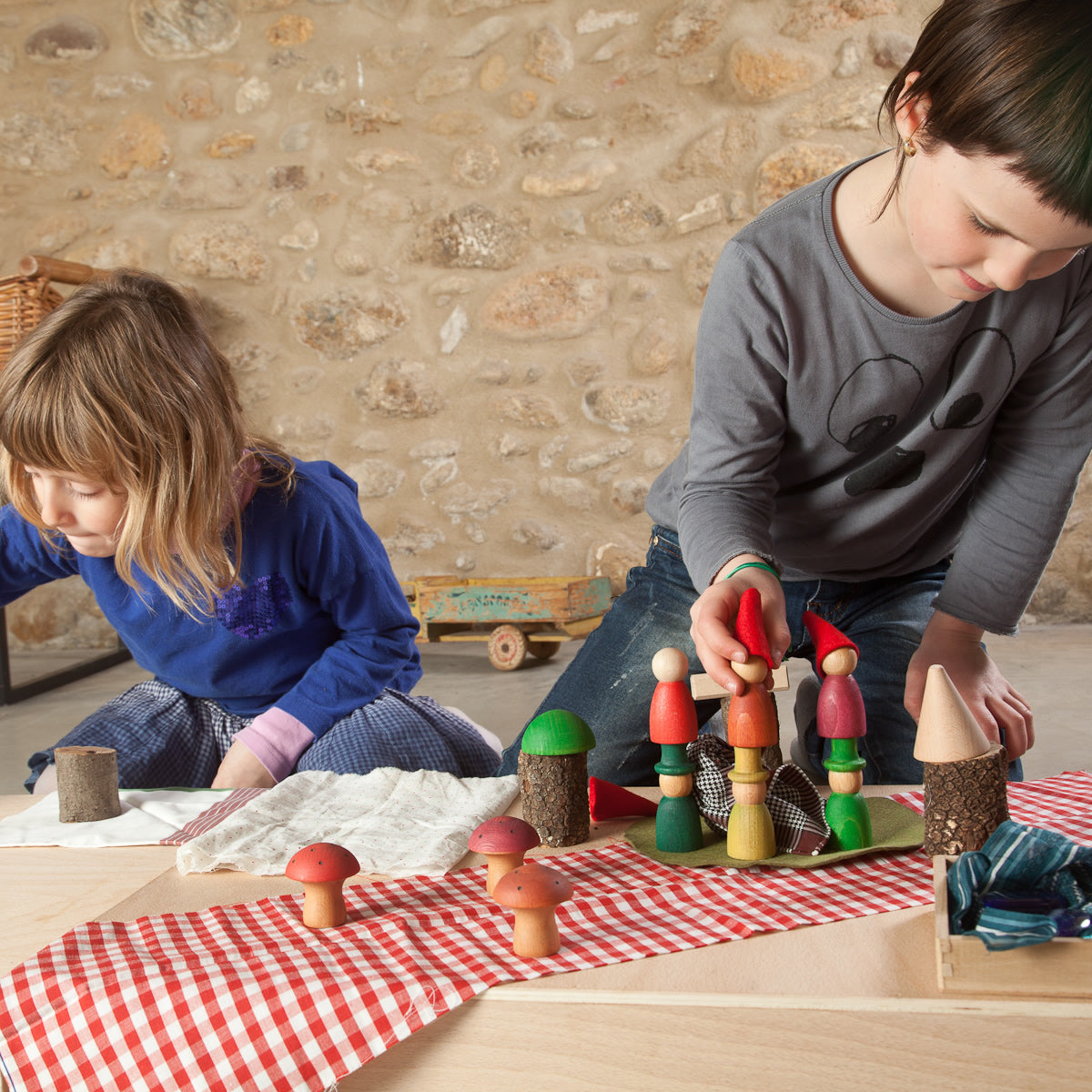 a wooden peg doll set to create a magical woodland scene. Perfect for story telling and imaginative small world play. White background.