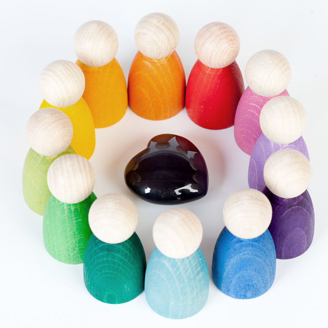 Grapat 12 Nins Wooden Peg Dolls in the colours of the rainbow with wood and stone natural resources. A classic Waldorf peg doll toy for open ended play. White background.