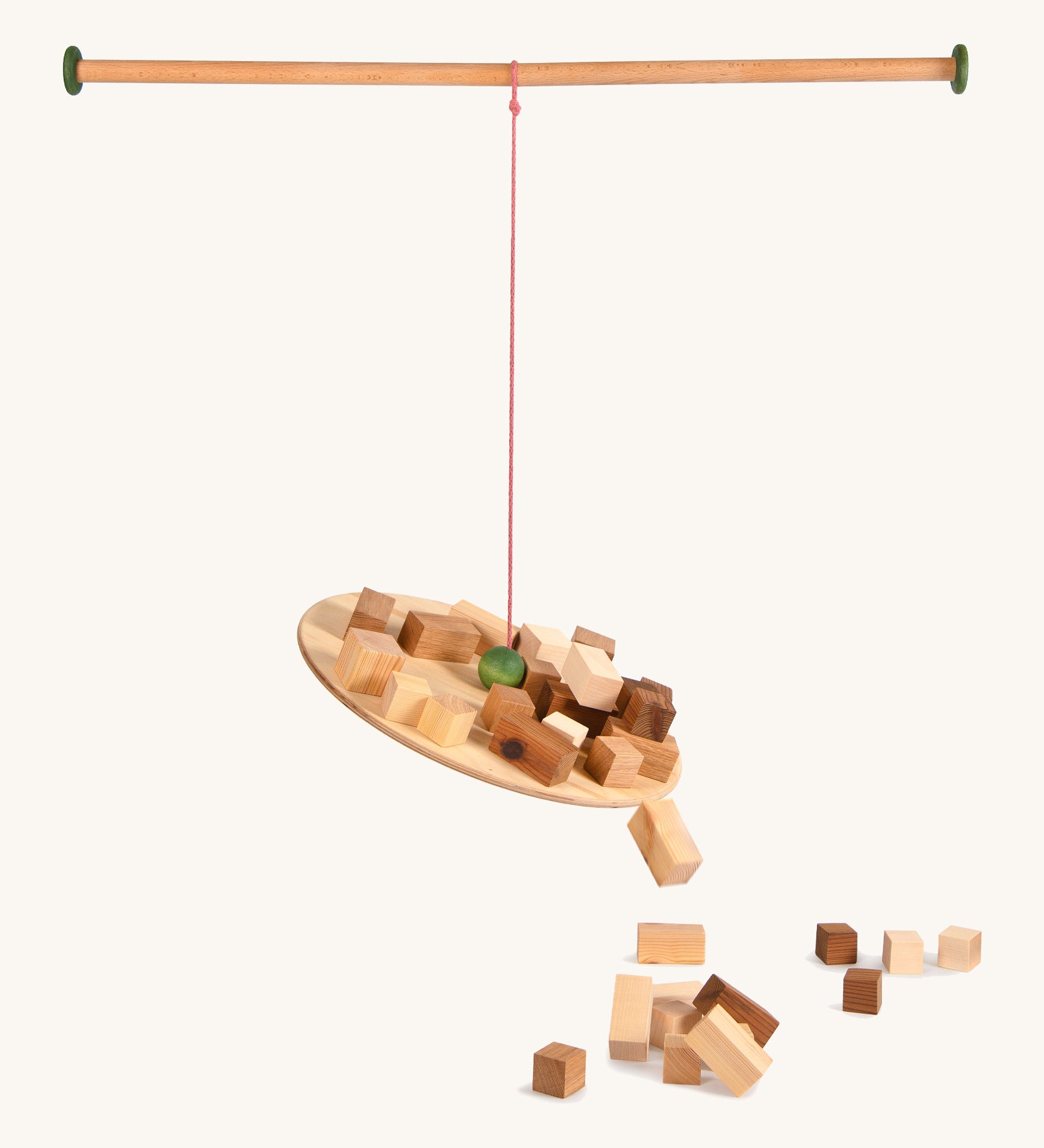 Grapat the pendlum set - handcrafted wooden pendulum. Features a wooden balancing board and wooden pole with different sized handcrafted wooden blocks balancing and falling off the pendulum. Ideal for balancing games.