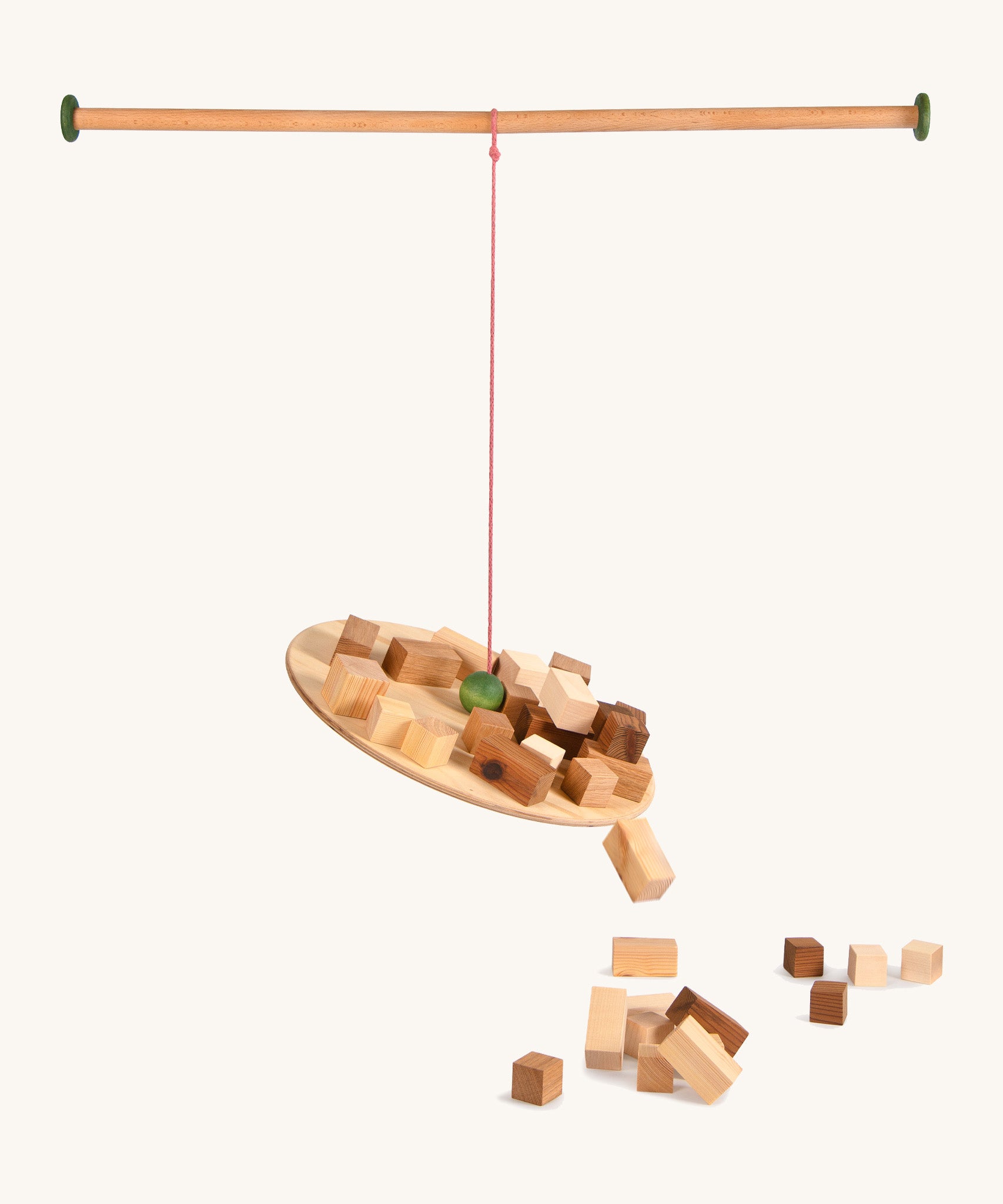 Grapat wooden pendulum set with wooden blocks on a cream background