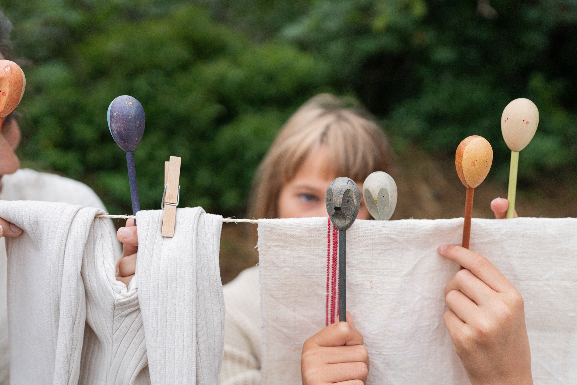 Grapat wooden twin soul puppets played with on a washing line