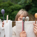 Grapat wooden twin soul puppets played with on a washing line