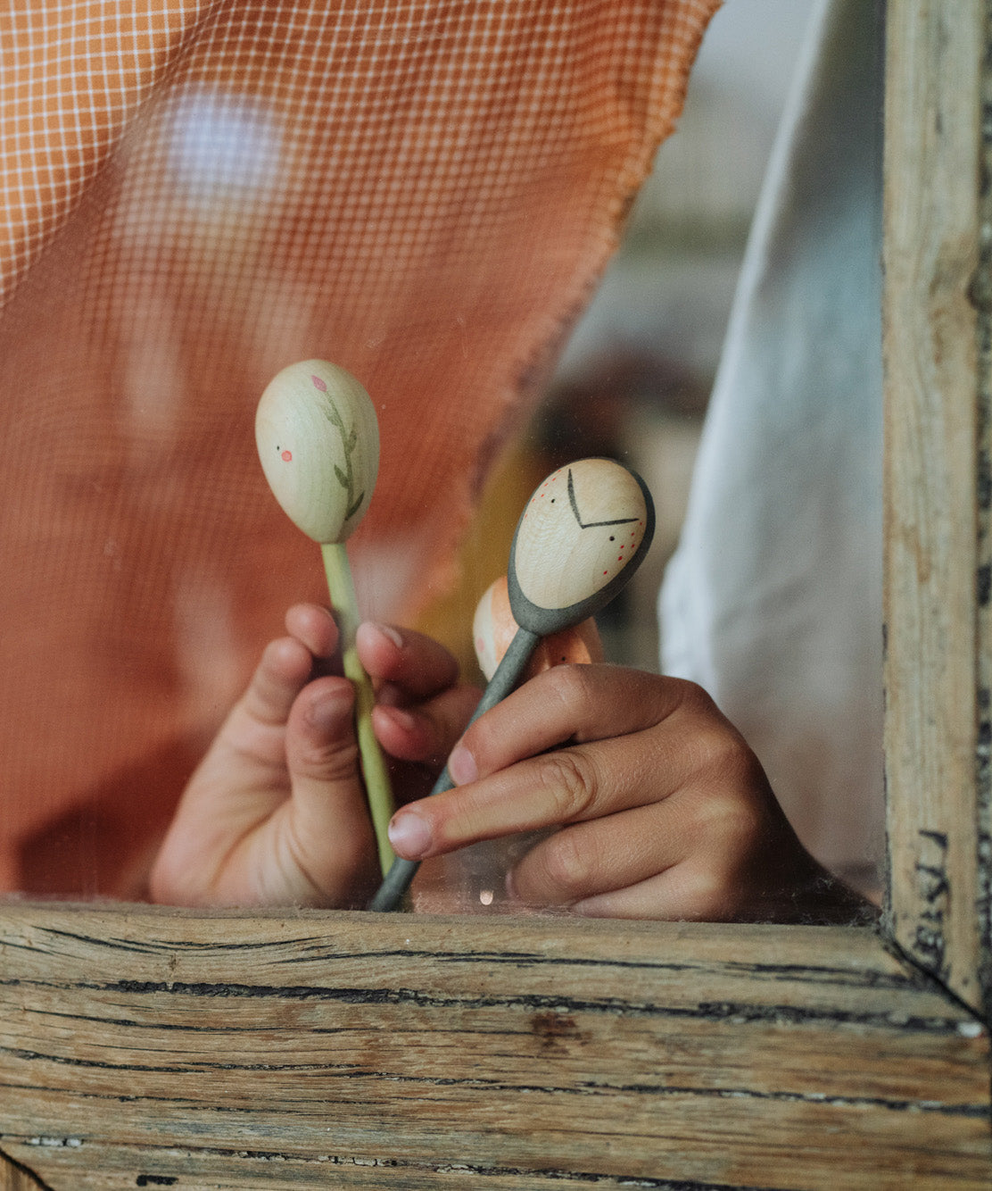 Grapat wooden twin soul puppets being played with 