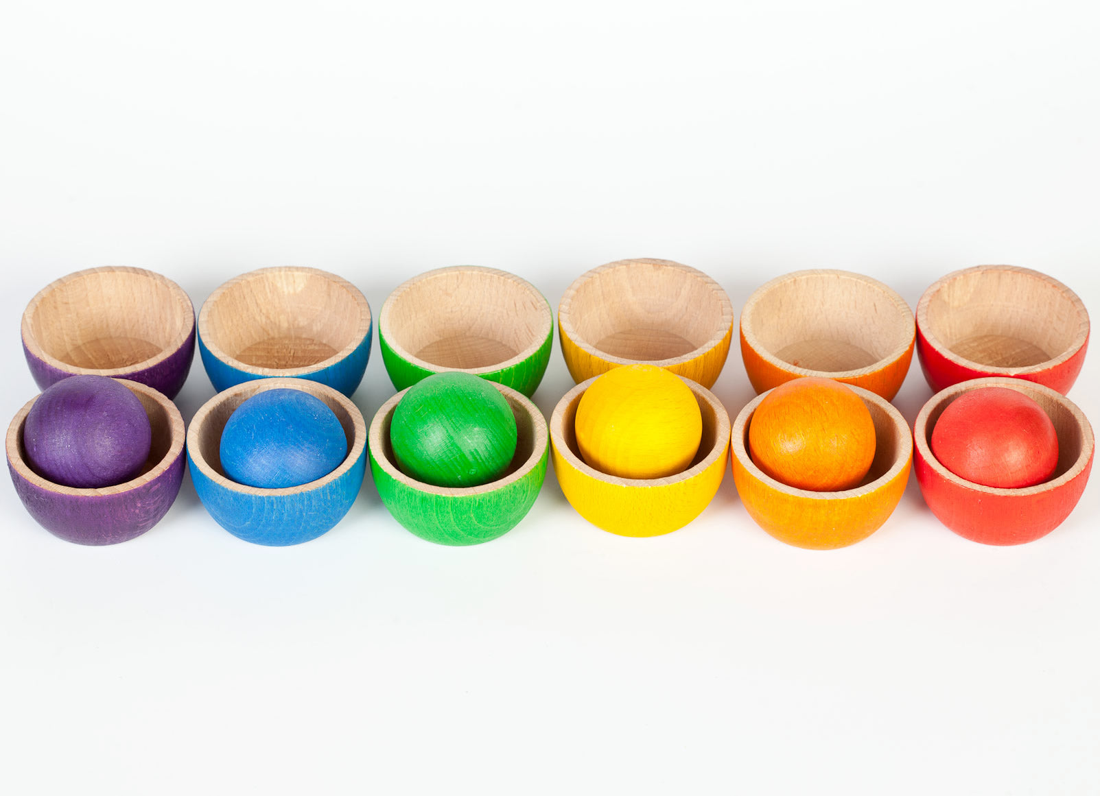 Grapat Bowls & Balls Wooden Toy Set - 12 small wooden toy bowls in 6 rainbow colours and 6 wooden balls. Colour matching and sorting