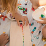 A child playing with the The Grapat Mis & Match play set