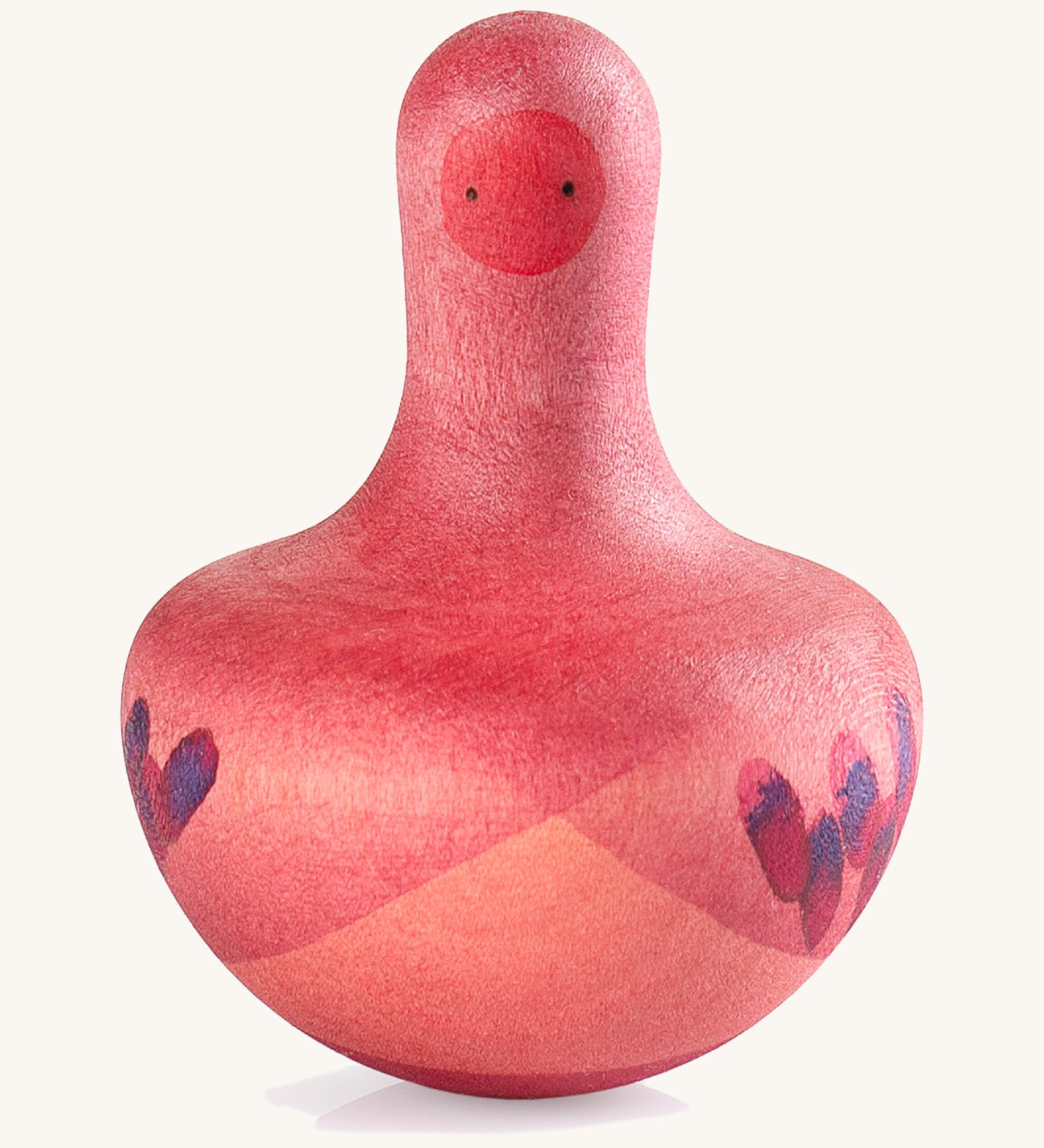 Grapat pink flowing bird - A vibrant tactile wooden pink wobbly bird with hand painted small face with a hand painted contrast purple feather detailing