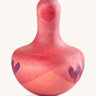 Grapat pink flowing bird - A vibrant tactile wooden pink wobbly bird with hand painted small face with a hand painted contrast purple feather detailing