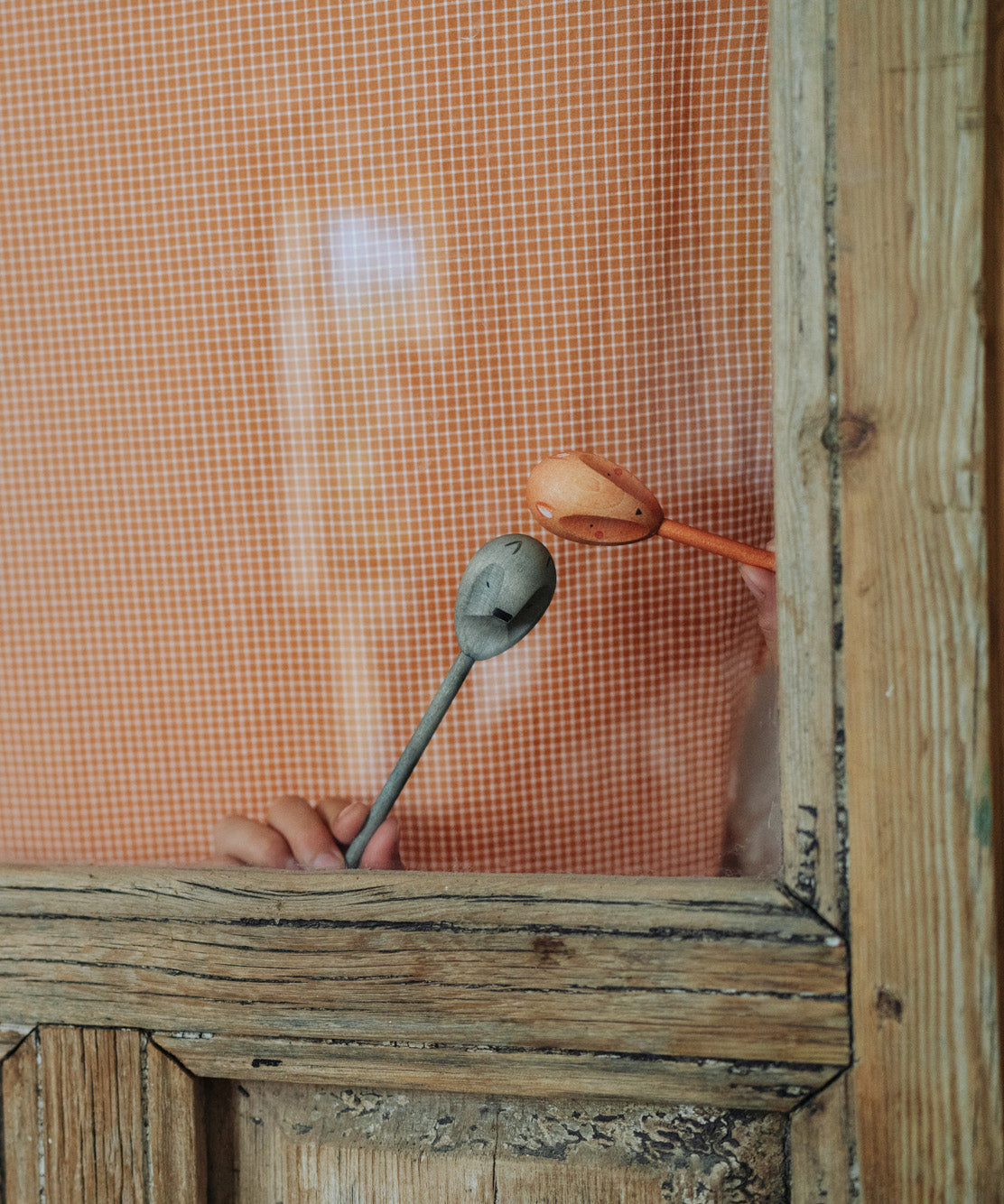 Grapat wooden twin soul puppets played with behind a window frame