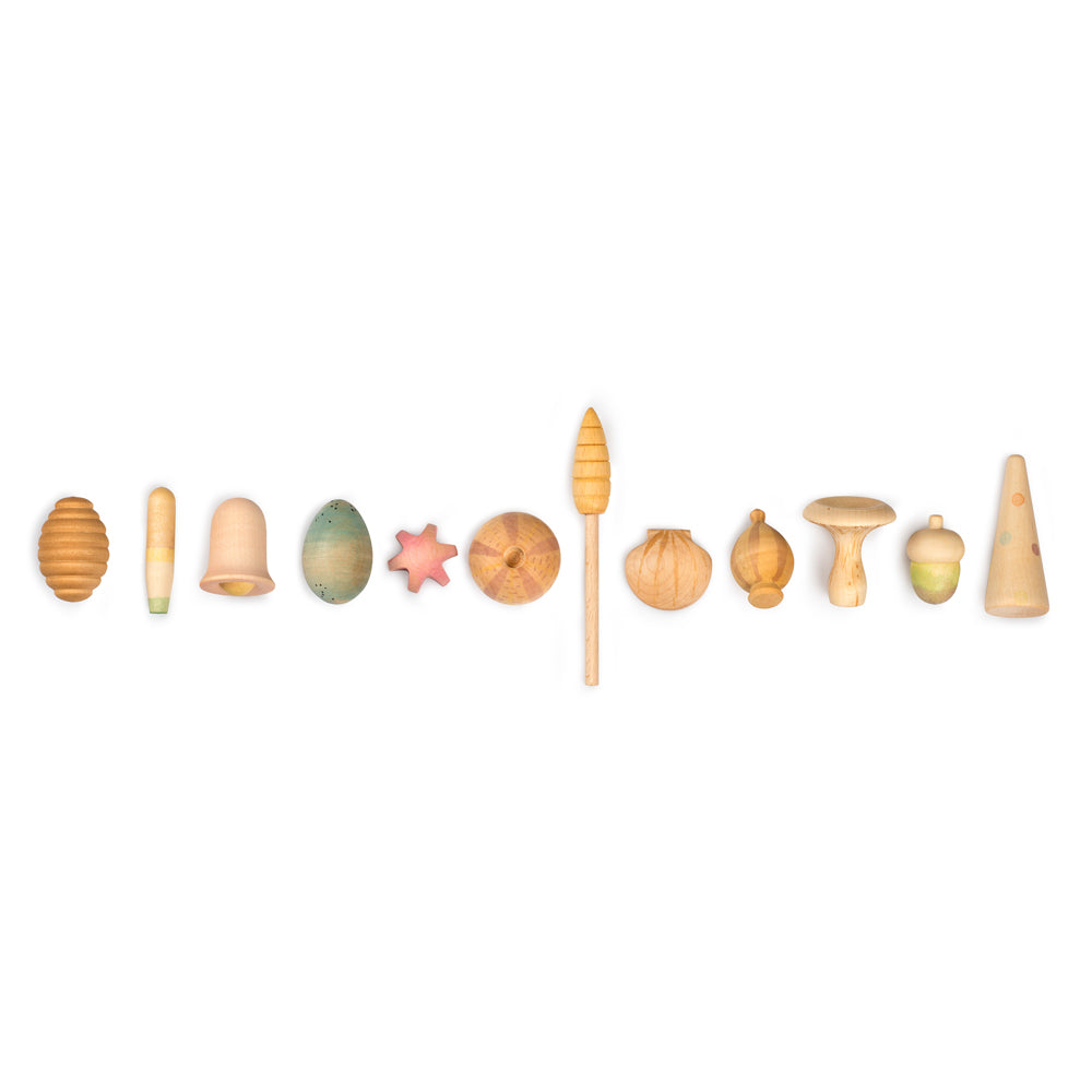 Grapat eco-friendly wooden wonders toy set laid out in a line on a white background