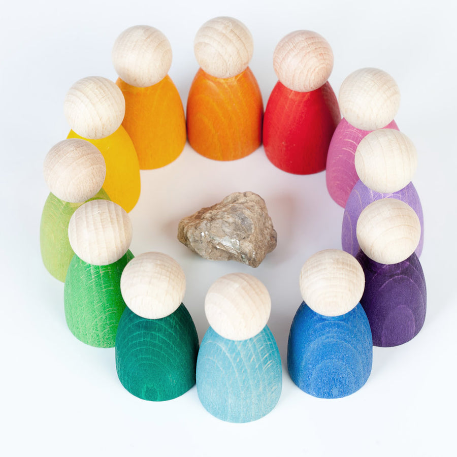 Grapat 12 Nins Wooden Peg Dolls in a circle