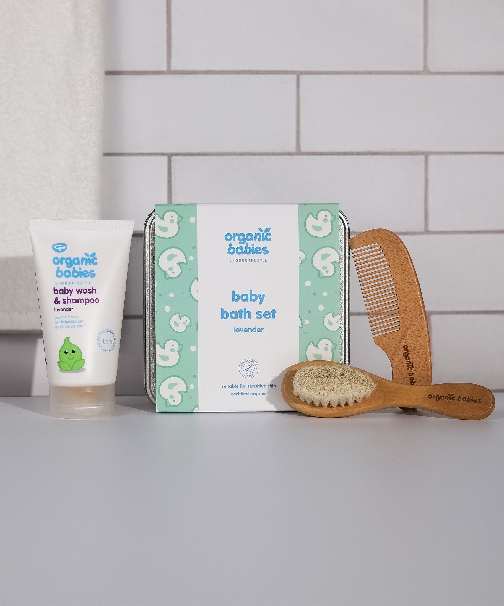 The contents and metal tin of the Organic Babies Green People Baby Bath Set