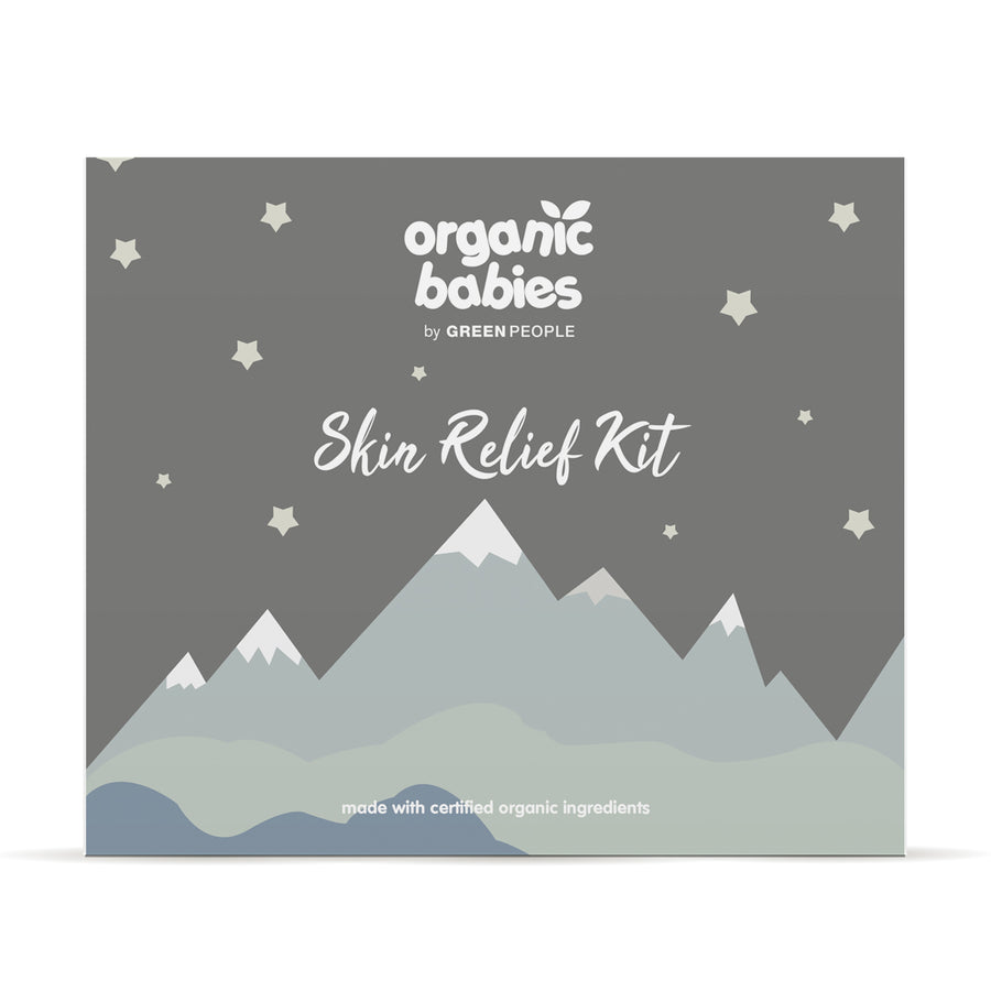 Organic Babies Skin Relief Kit featured in a flatlay surrounded by baby toys and eucalyptus ;eaves