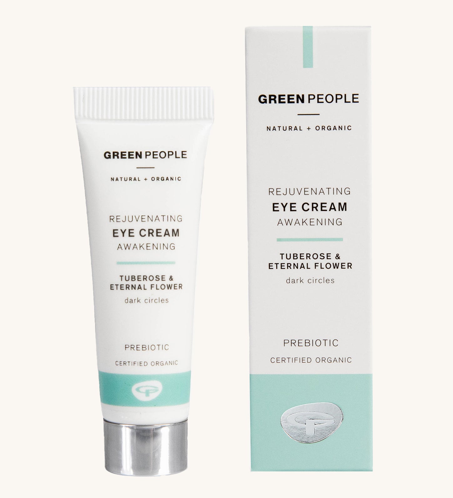 Green People Rejuvenating Eye Cream in a tube next to the cardboard packaging on a plain background. 