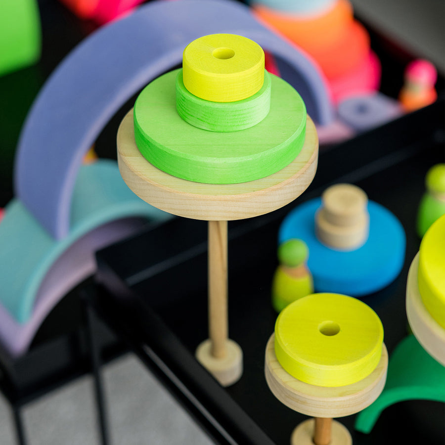 Grimm's Conical Stacking Tower - Neon Green - In a home environment. Grimm's Rainbows