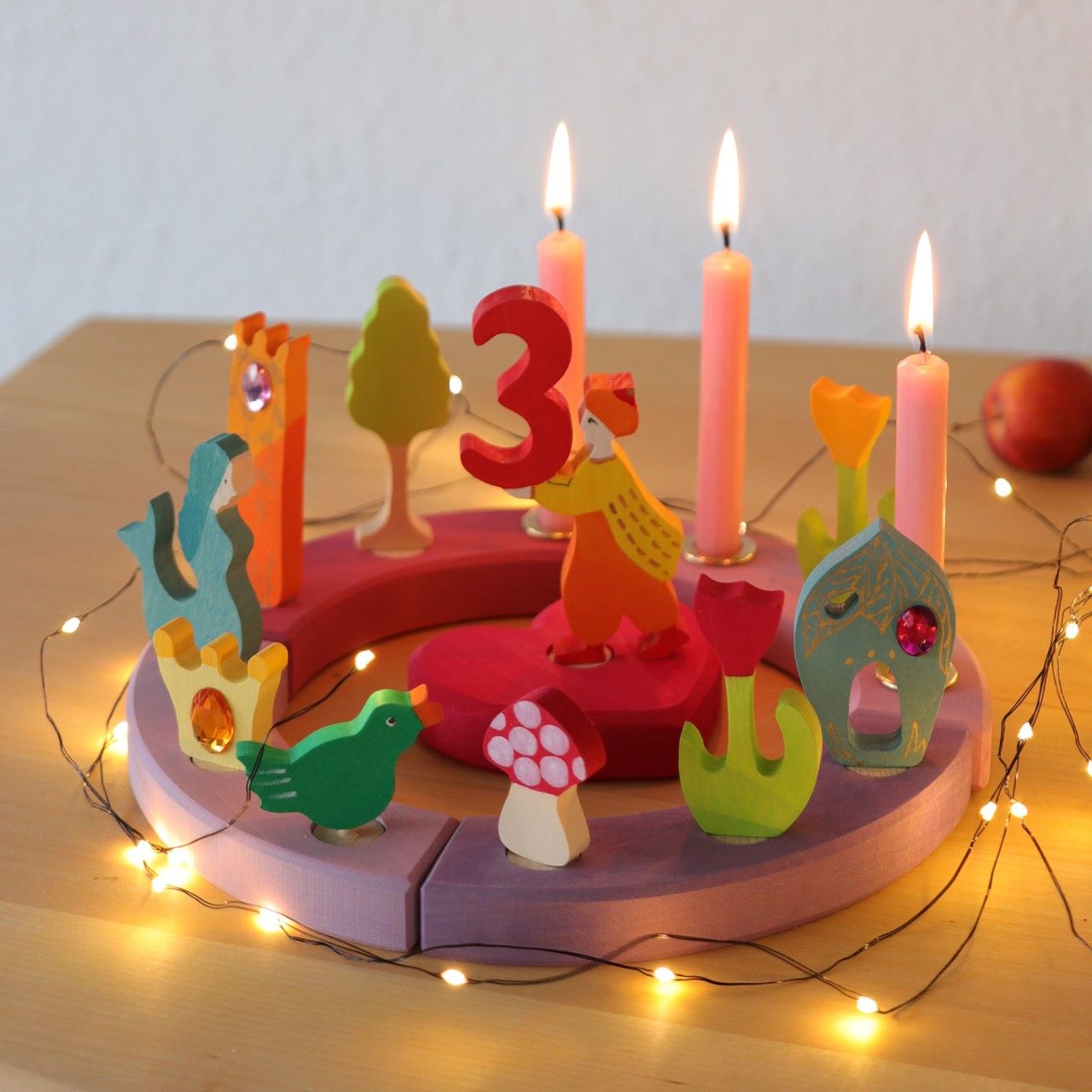 Grimm's 12-Hole Pink-Purple Wooden Celebration Ring with pink candles