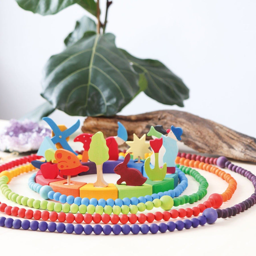 Grimm's 12-Piece Rainbow Birthday Celebration Ring with decorative figures and colourful beads