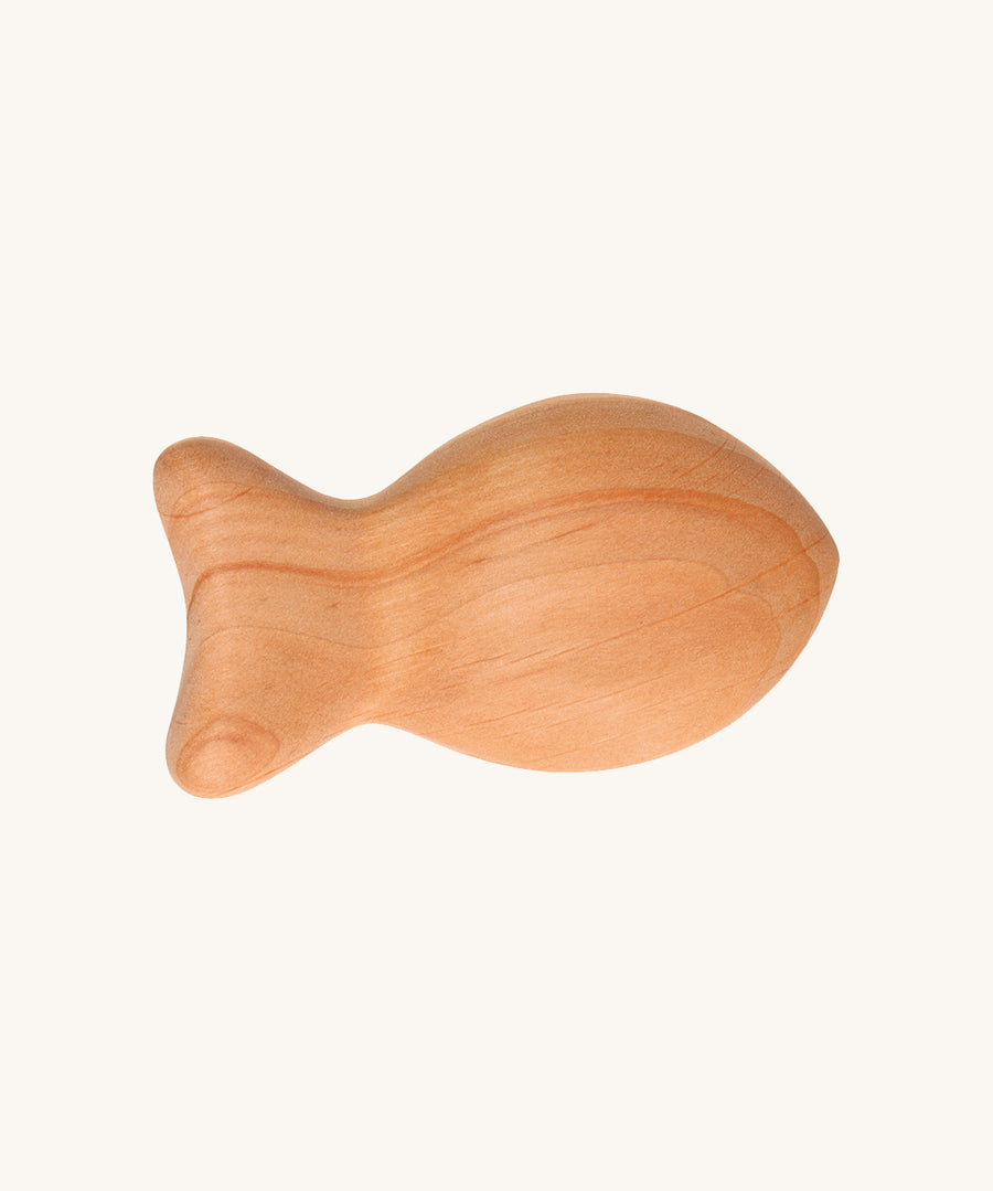 Grimm's Wooden Baby Rattle - Fish in a natural alder wood finish on a cream background