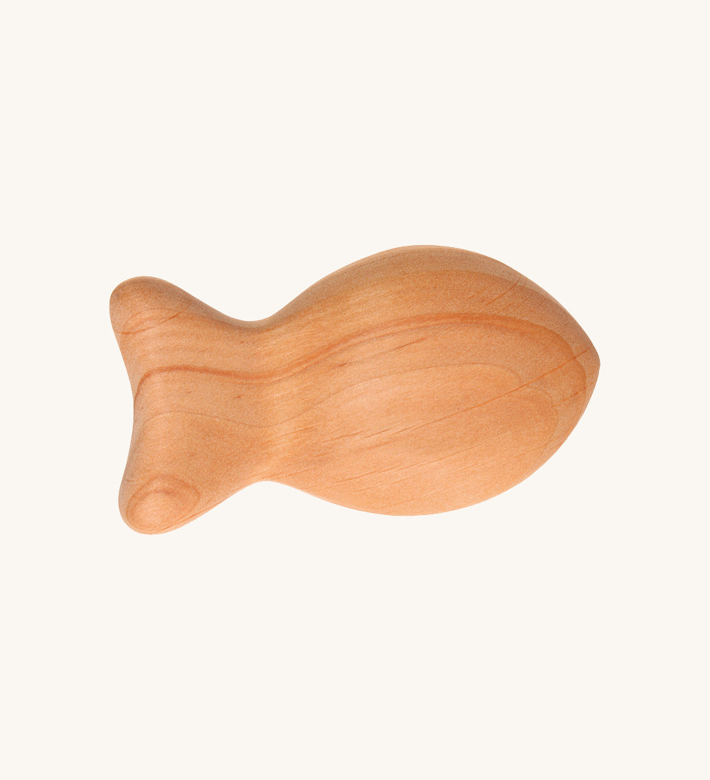 Grimm's Wooden Baby Rattle - Fish in a natural alder wood finish on a cream background