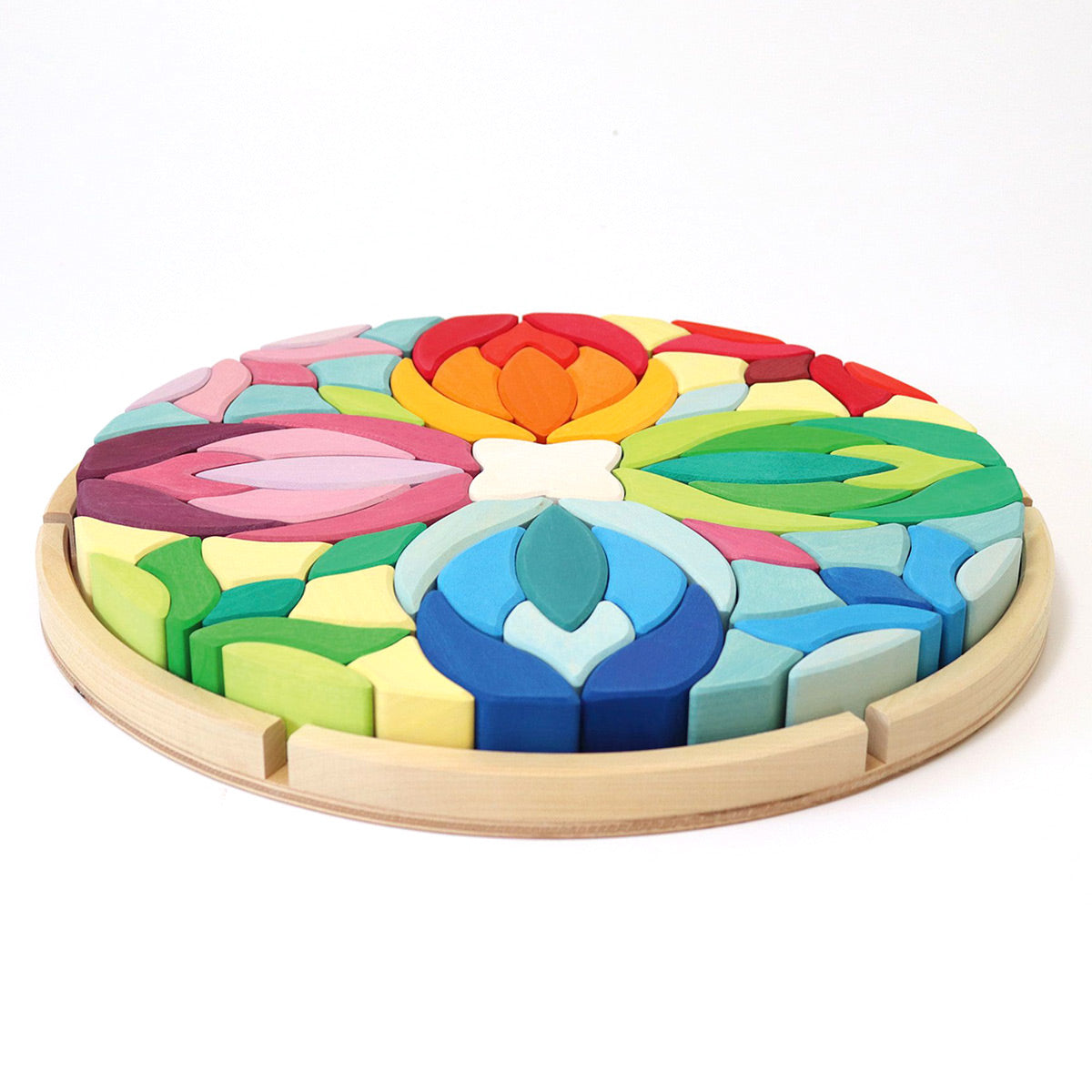 Grimm's plastic-free wooden Lara toy blocks set in their wooden base on a white background