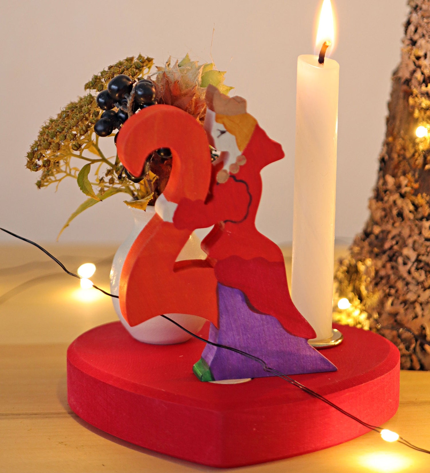 Grimm's Large Red Heart Celebration Ring with a number 2 decorative figure, a decorative vase and a candle. 