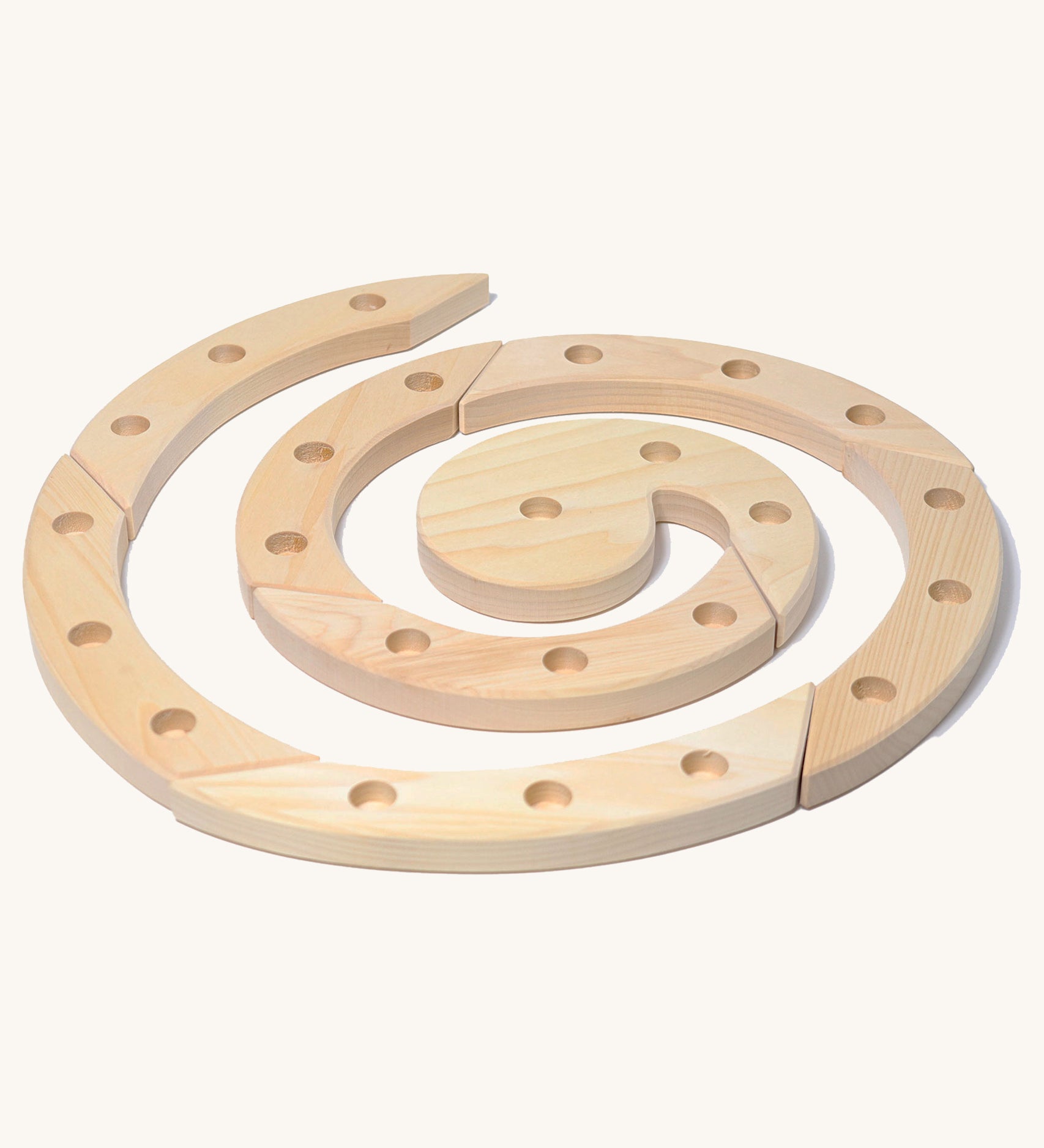 Grimm's Natural Wooden Spiral celebration ring n a plain background. 