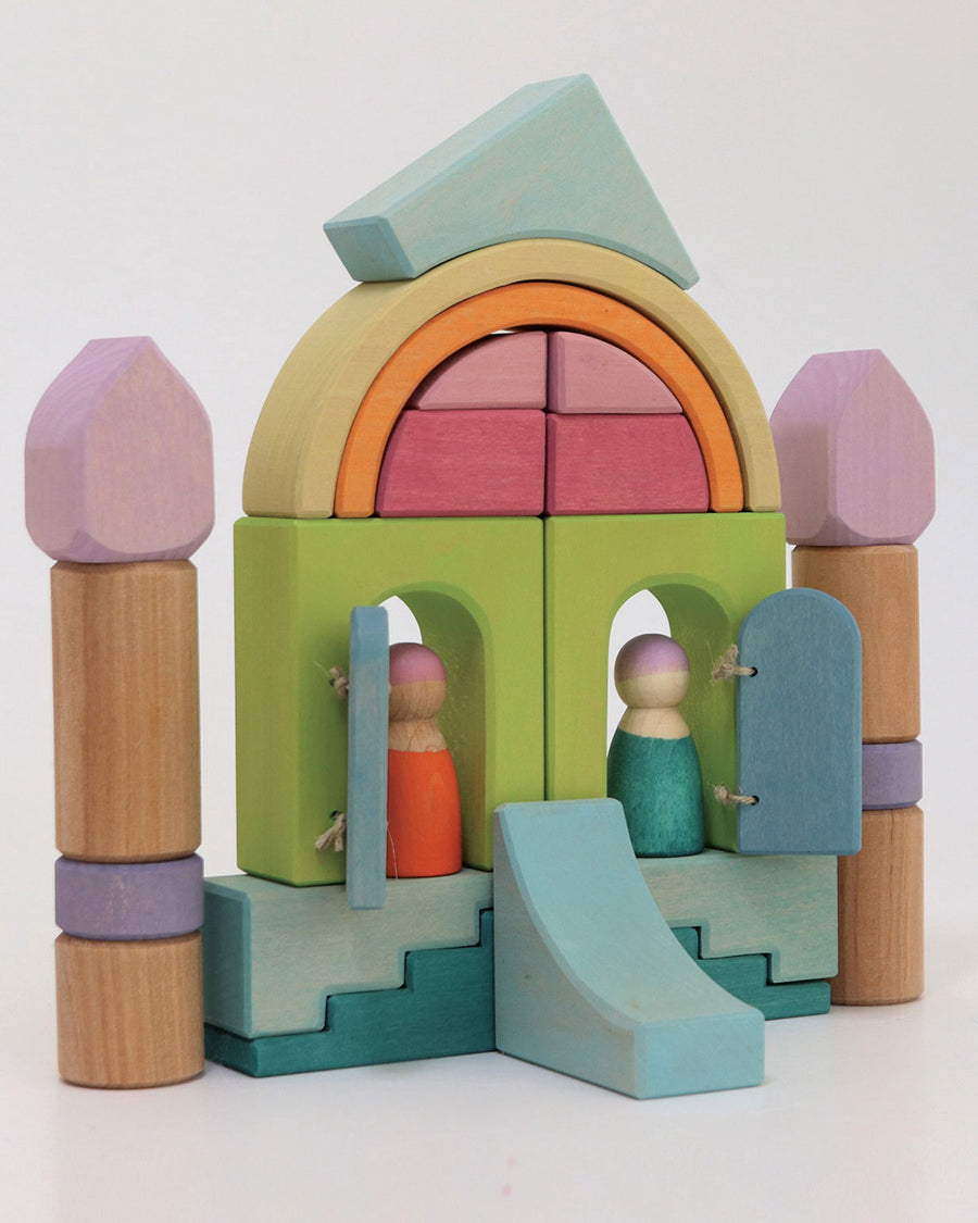 A beautiful house play scene created by using the Grimm's Cloud Play set. The wooden tray base has been used as the house foundation