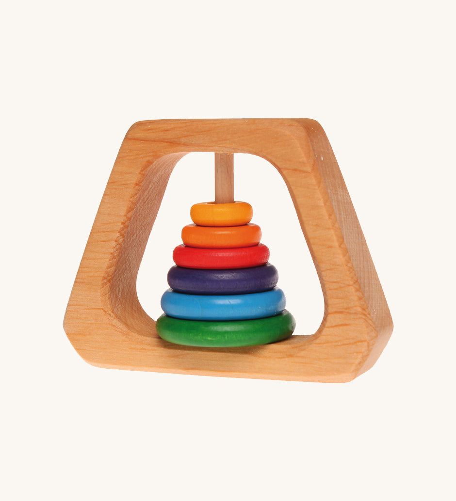 Grimm's Grasping Pyramid Rattle for babies on a cream background