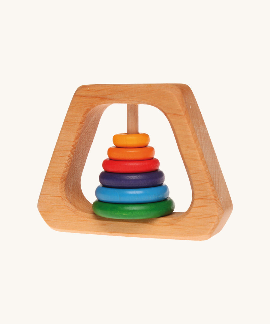 Grimm's Grasping Pyramid Rattle for babies on a cream background