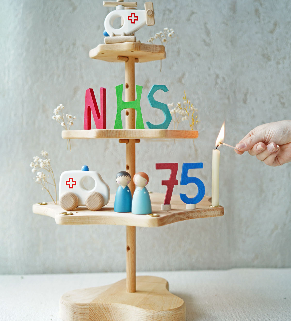 A Grimm's seasonal festivity stand decorated to celebrate the NHS's 75th birthday. The decorations Include a Bajo helicopter and ambulance