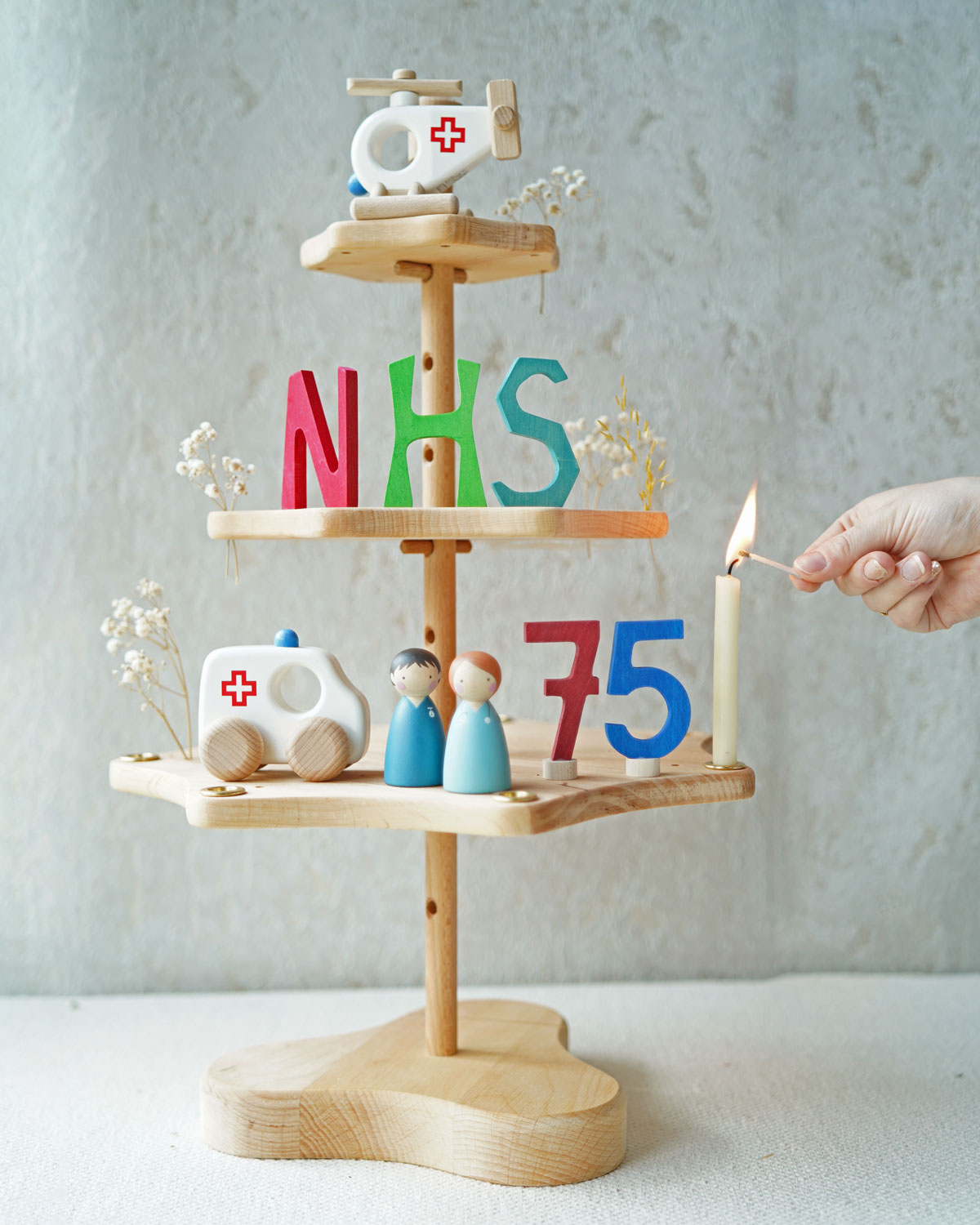 A Grimm's seasonal festivity stand decorated to celebrate the NHS's 75th birthday. The decorations Include a Bajo helicopter and ambulance