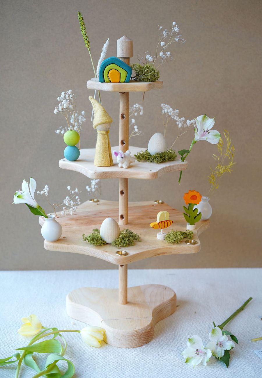 Grimm's Seasonal Festivity Stand descorated for Spring and Easter with wooden eggs