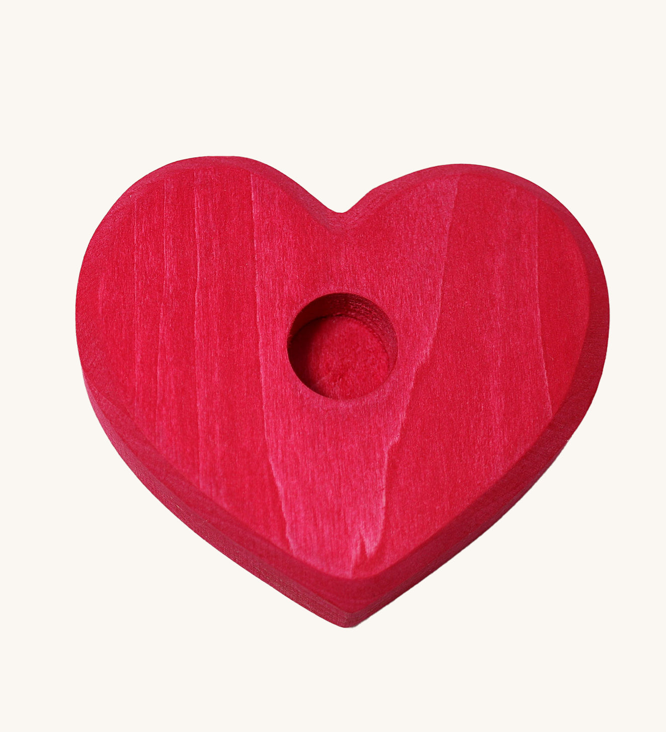 Grimm's Small Red Heart for celebration ring figures and Grimm's candles on a plain background. 