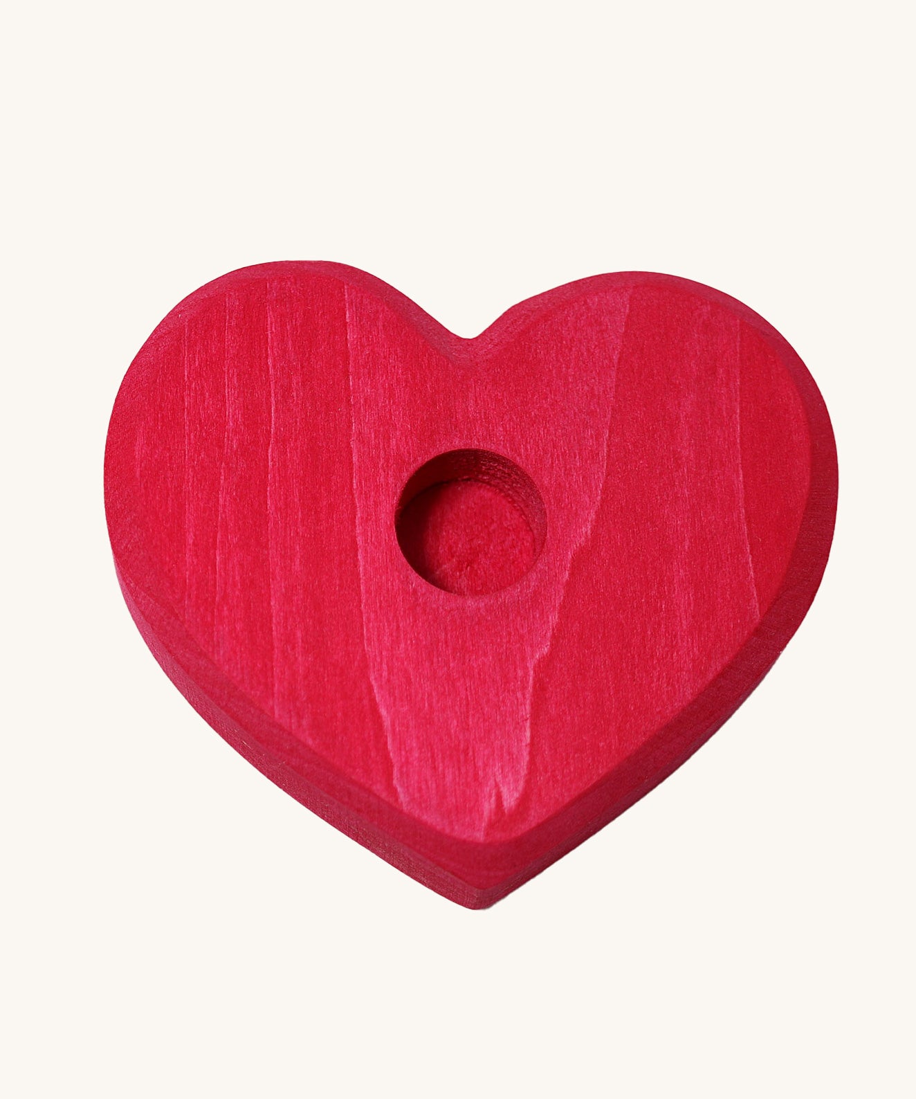 Grimm's Small Red Heart for celebration ring figures and Grimm's candles on a plain background. 