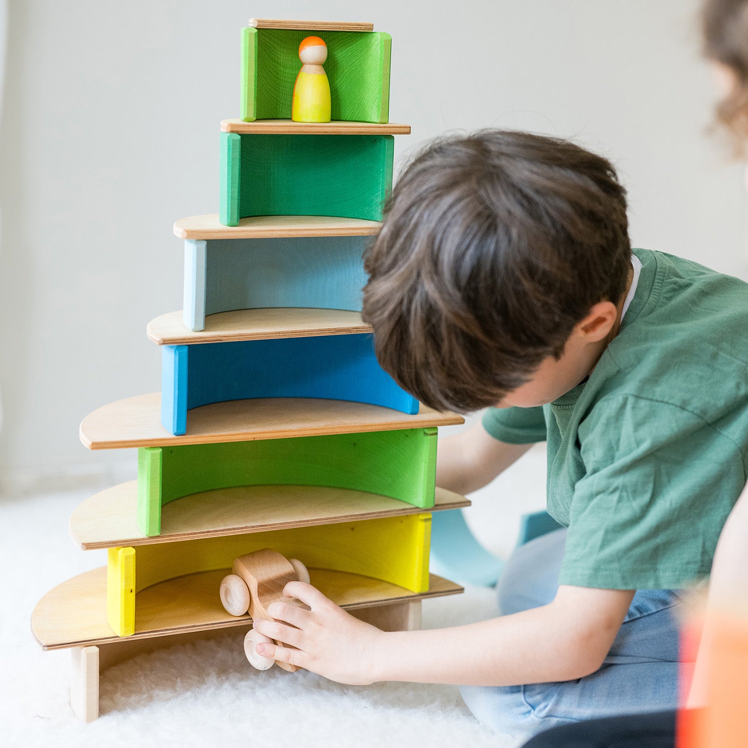 Tower toys and Neon friends are used together to make a play scene.