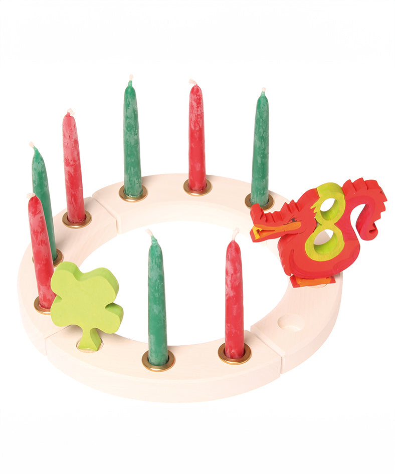 Grimm's White 12-Hole Celebration Ring with red and green candles, a four leafed clover and number figures. 