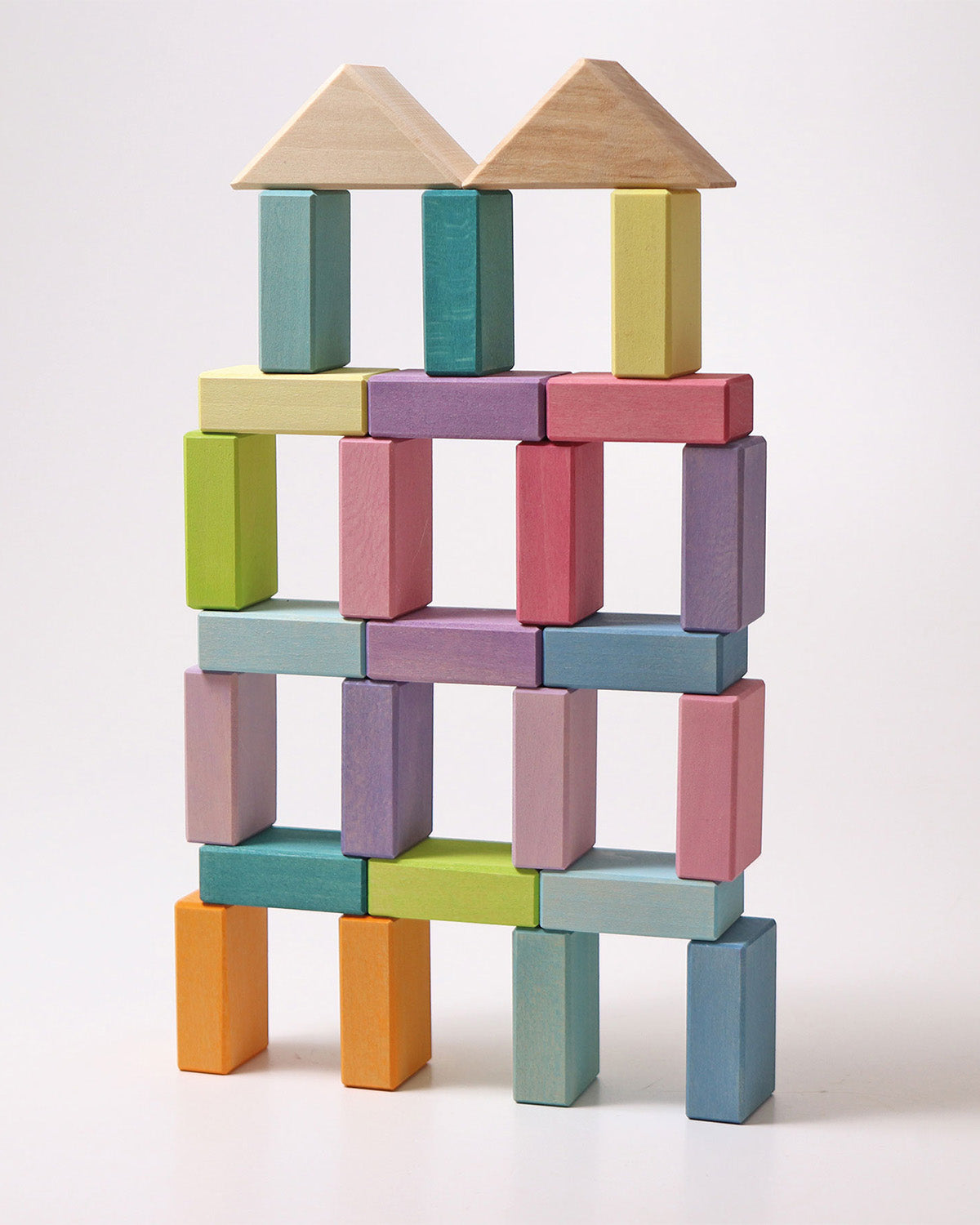 A large building has been made using the Grimms Wooden Pastel Duo Blocks. The roof is made from the natural blocks