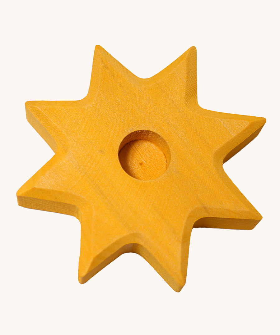 Grimm's Yellow Lifelight Star decorative figure holder on a plain background.