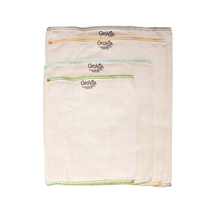 4 sizes of the Grovia eco-friendly nappy cloths laid out on a white background