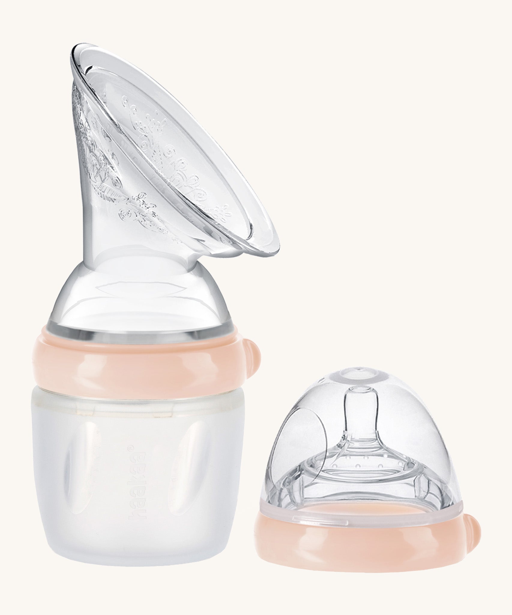 Generation 3 160ml Breast Pump and Baby Bottle Top Set, in peach on a cream background. This set come with the Haakaa Gen. 3 Silicone Breast Pump and Baby Bottle Top.