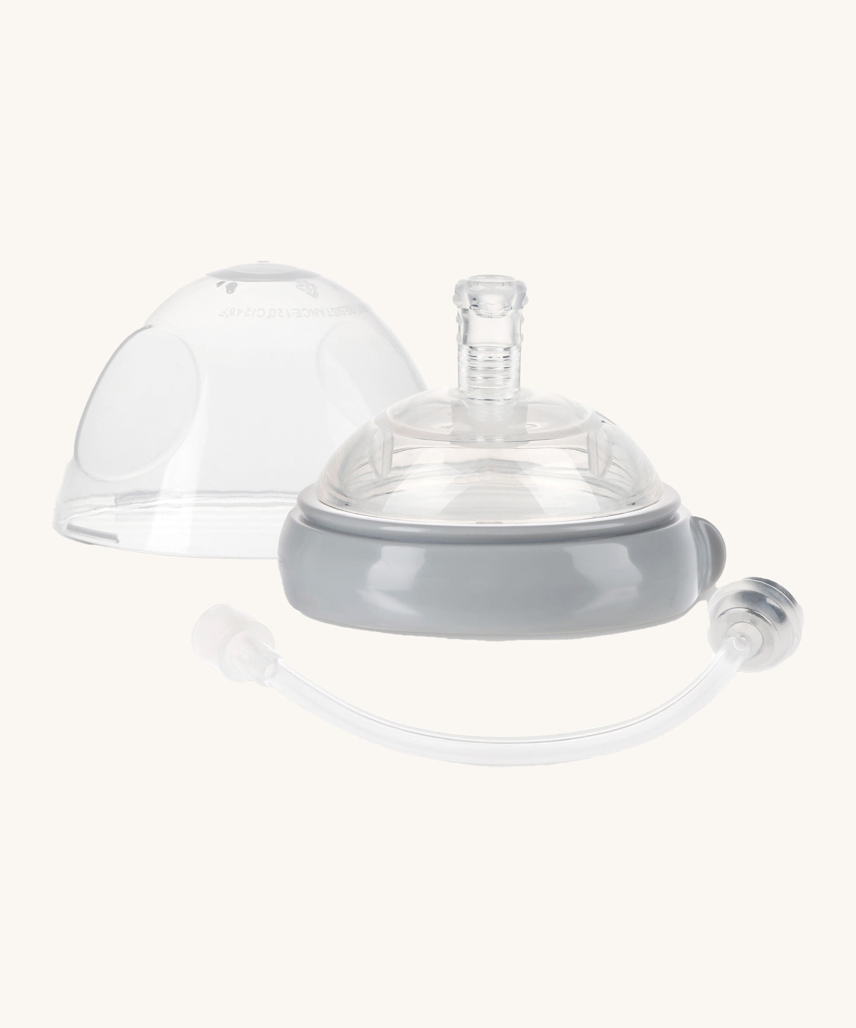 Haakaa 3rd generation sippy spout set. A silicone attachment with a weighted straw, a protective dust cap and a a grey attachment ring