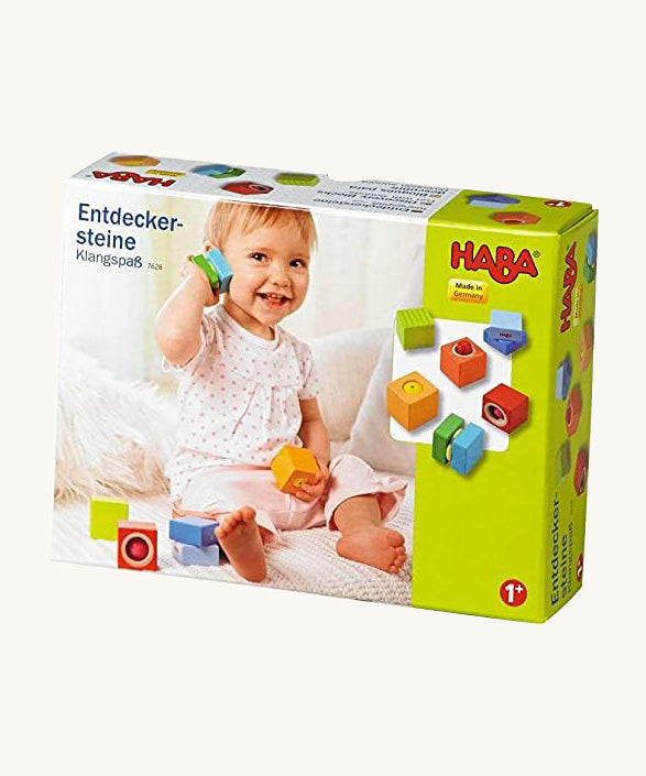 A cardboard box with a picture of a child playing with the blocks for the Haba blocks with sounds on a cream background.