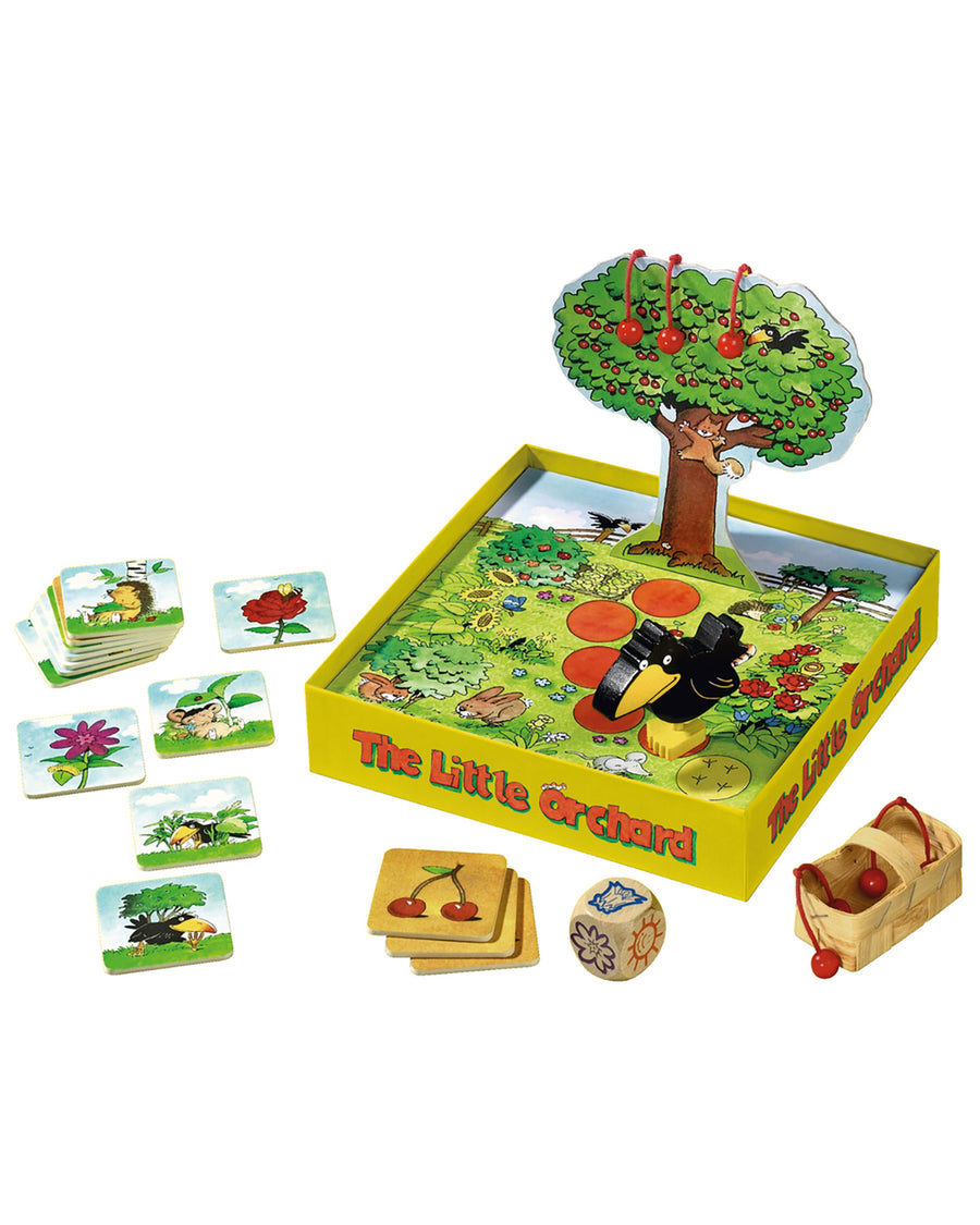 A child playing the Haba Orchard game