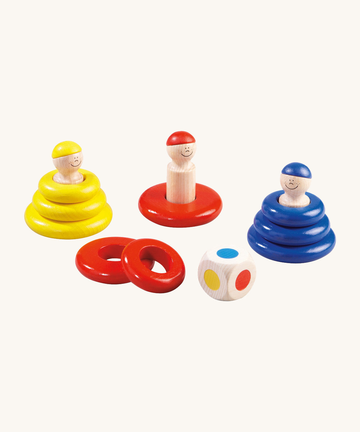 A yellow, red and blue Haba wooden ring toss game with a wooden dice on a cream background.