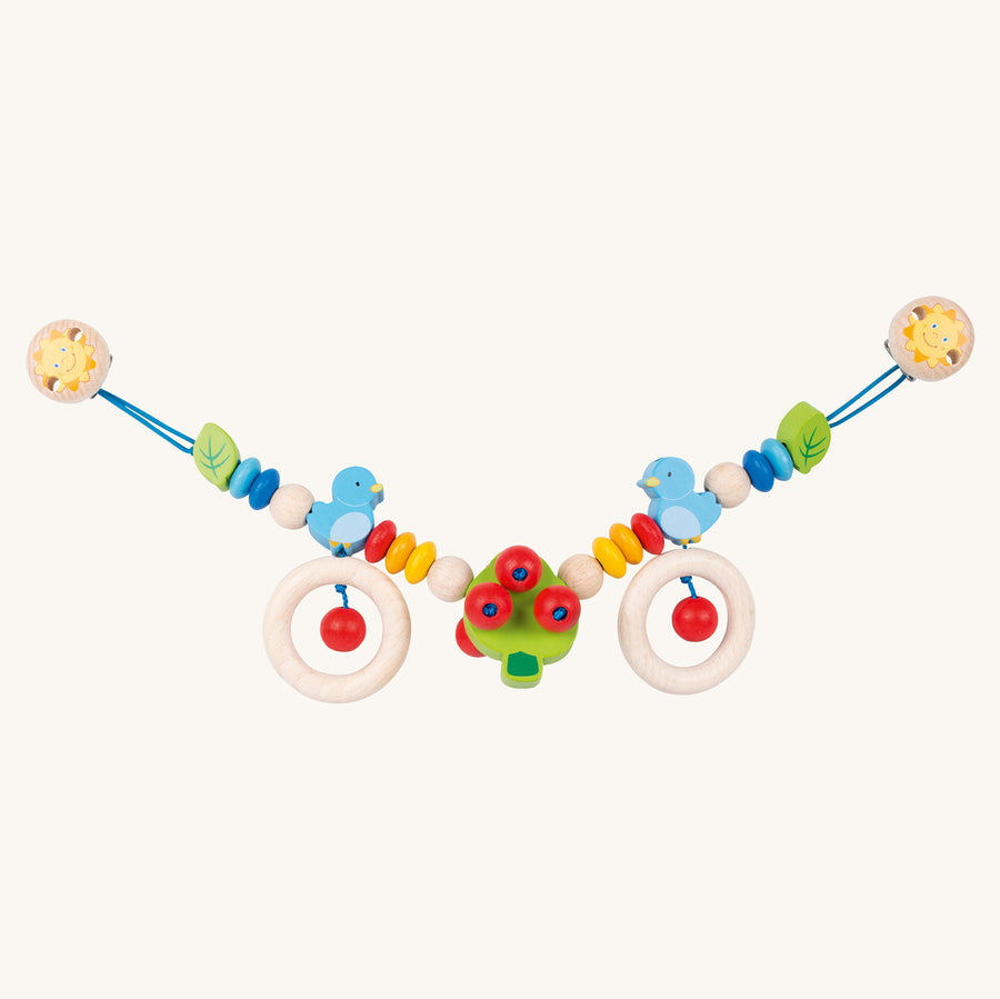 Heimess natural wooden baby pram teether chain with a bird design on a beige background