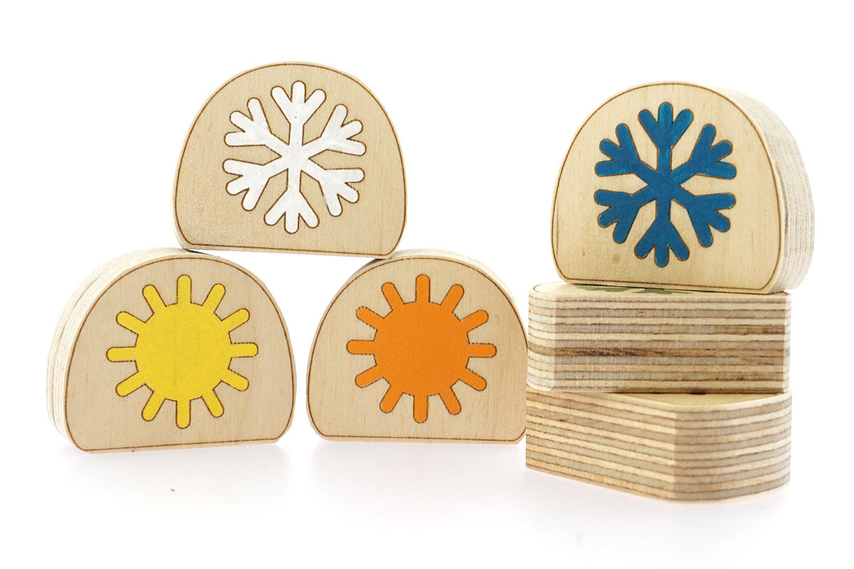 Hellion Toys handcrafted plastic-free wooden temperature blobs laid out on a white background