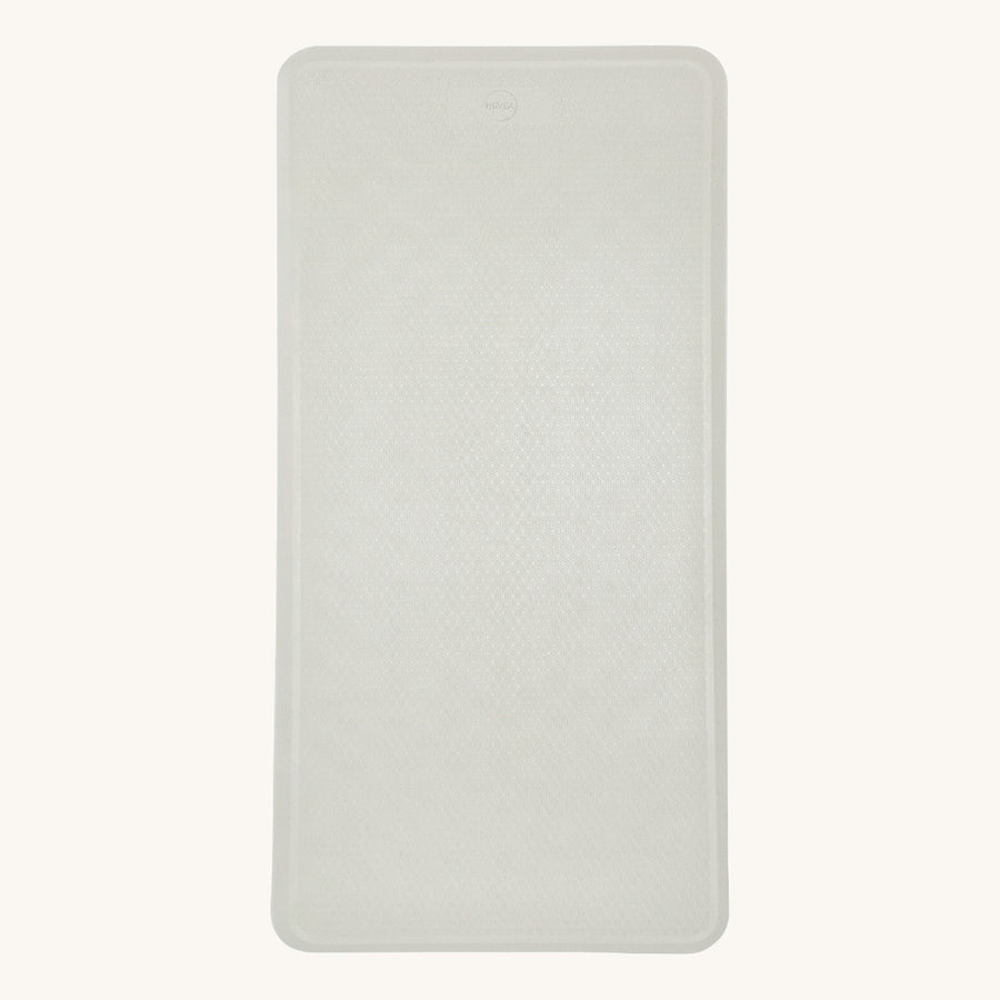 Hevea natural rubber bath mat in the marble grey on a beige background