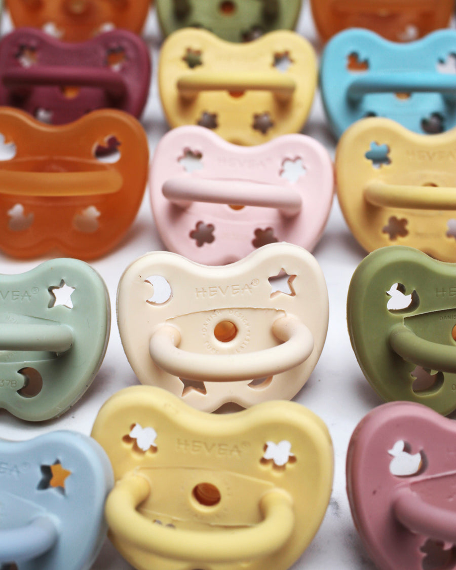 Close up of natural rubber Hevea dummies lined up on a white background